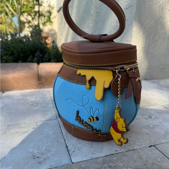 Danielle Nicole Handbags - Winnie the Pooh Honey Pot Crossbody Bag  by Danielle Nicole Límited edition